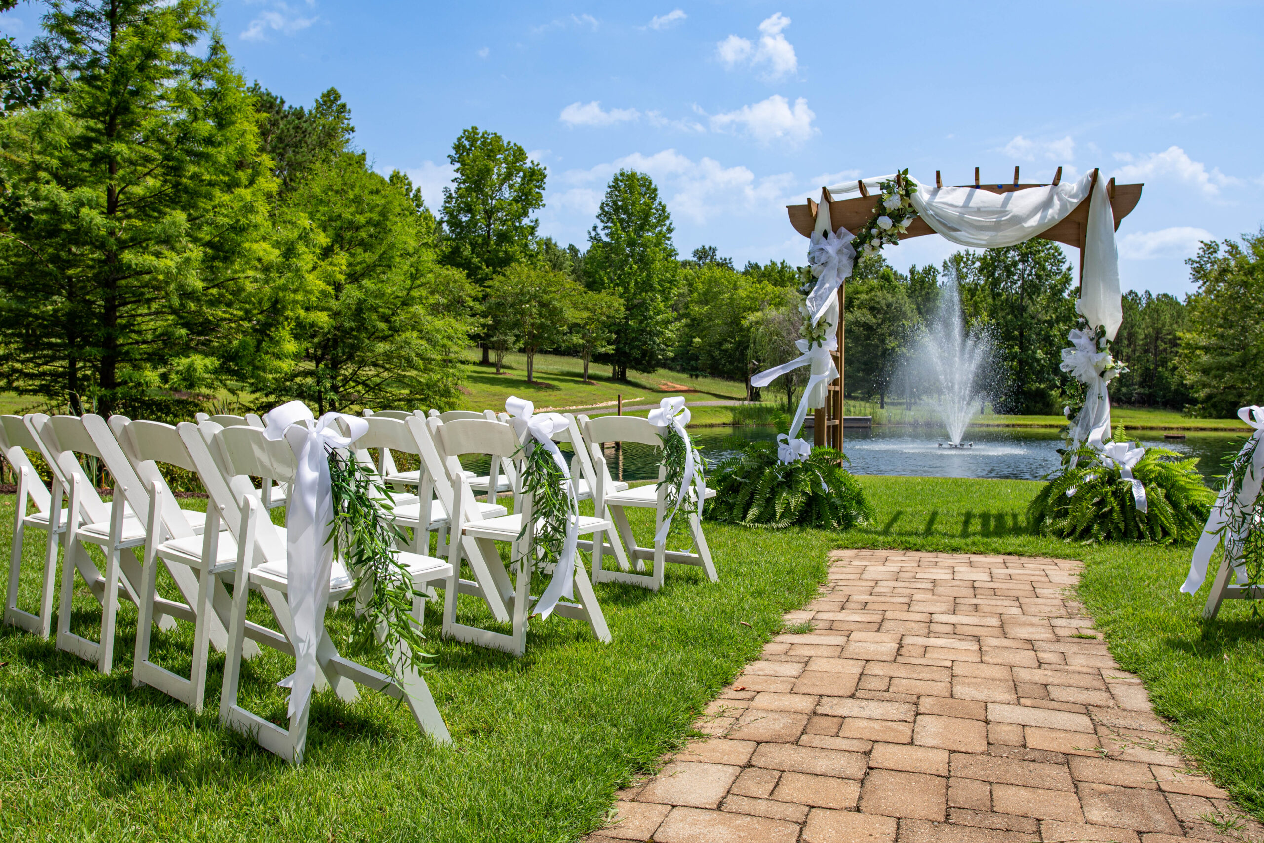 Ceremony setup with trellis and fountain