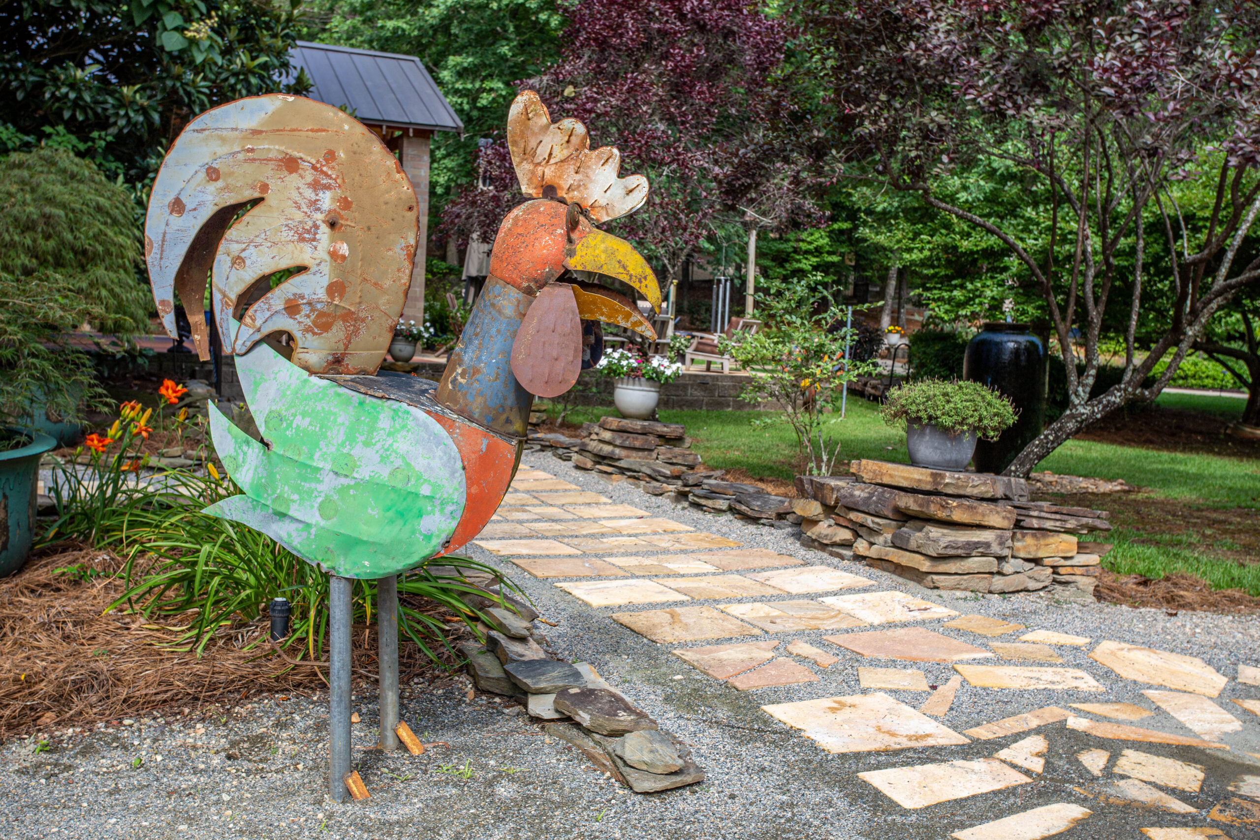 Whimsical rooster sculpture at Rock Bottom Pond