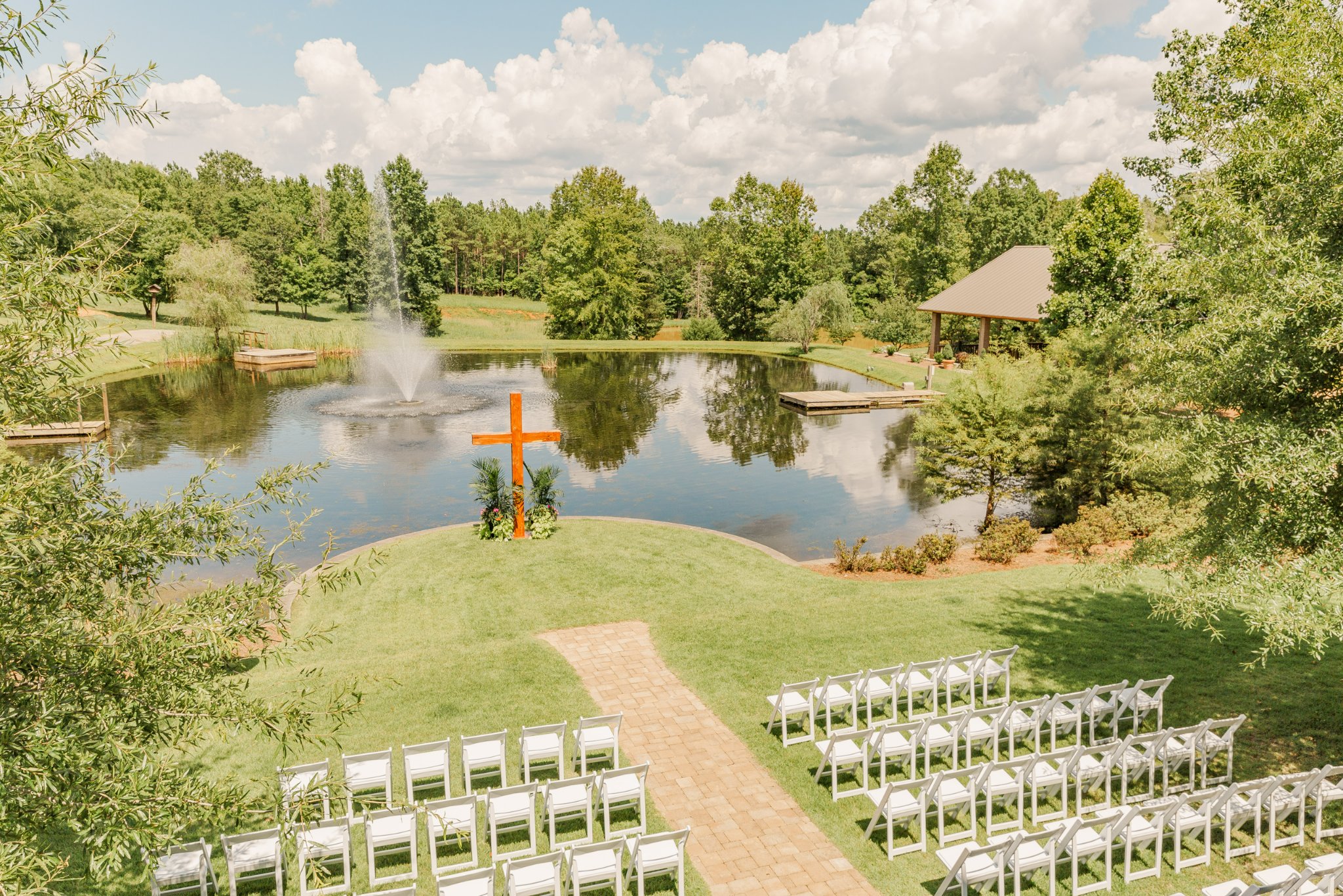 Outdoor wedding ceremony setup at Rock Bottom Pond
